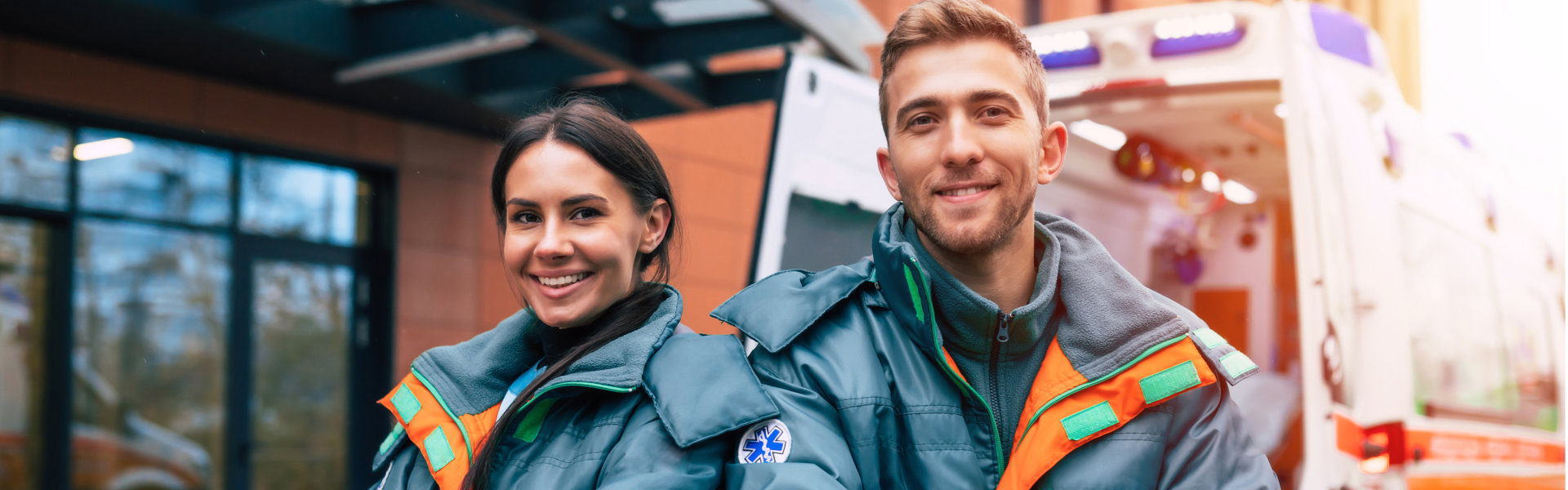 smiling female and male paramedics